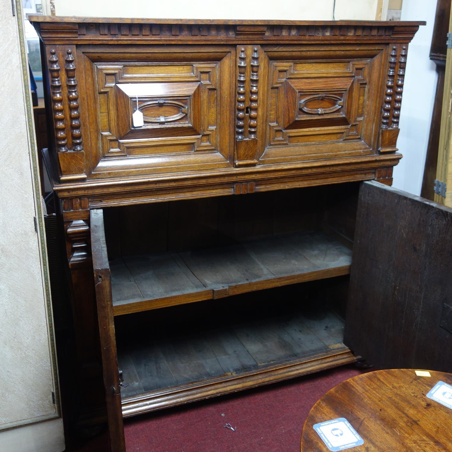 A 17th century oak panelled Antwerp cabinet, with four carved panelled doors, on moulded base and - Image 3 of 3