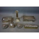 A collection of silver items to include 2 boxes, a candlestick, clothes brush, clock and 2 glass