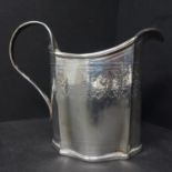 A Georgian silver milk jug, with engraved floral decoration, indistinctly hallmarked, H.10.5cm,