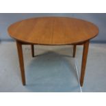 A mid 20th century teak extending dining table, on tapering legs, H.73 W.175 D.122cm (extended)