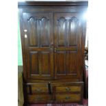 An early 18th century oak panelled linen press, c.1730, H.208 W.137 D.54cm