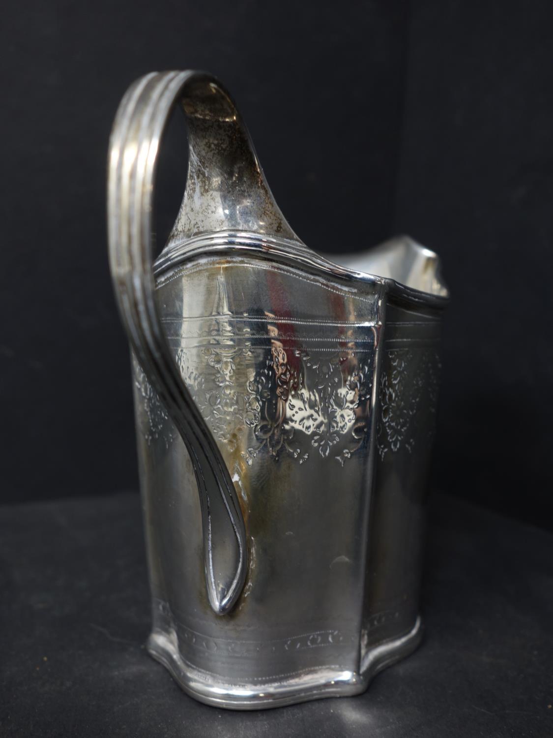 A Georgian silver milk jug, with engraved floral decoration, indistinctly hallmarked, H.10.5cm, - Image 3 of 6