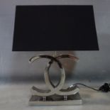 A Chanel style chrome table lamp with black shade, H.55cm