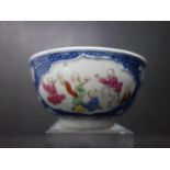 A 19th century Chinese blue and white porcelain tea bowl, with panels of figures playing, H.5 D.9cm