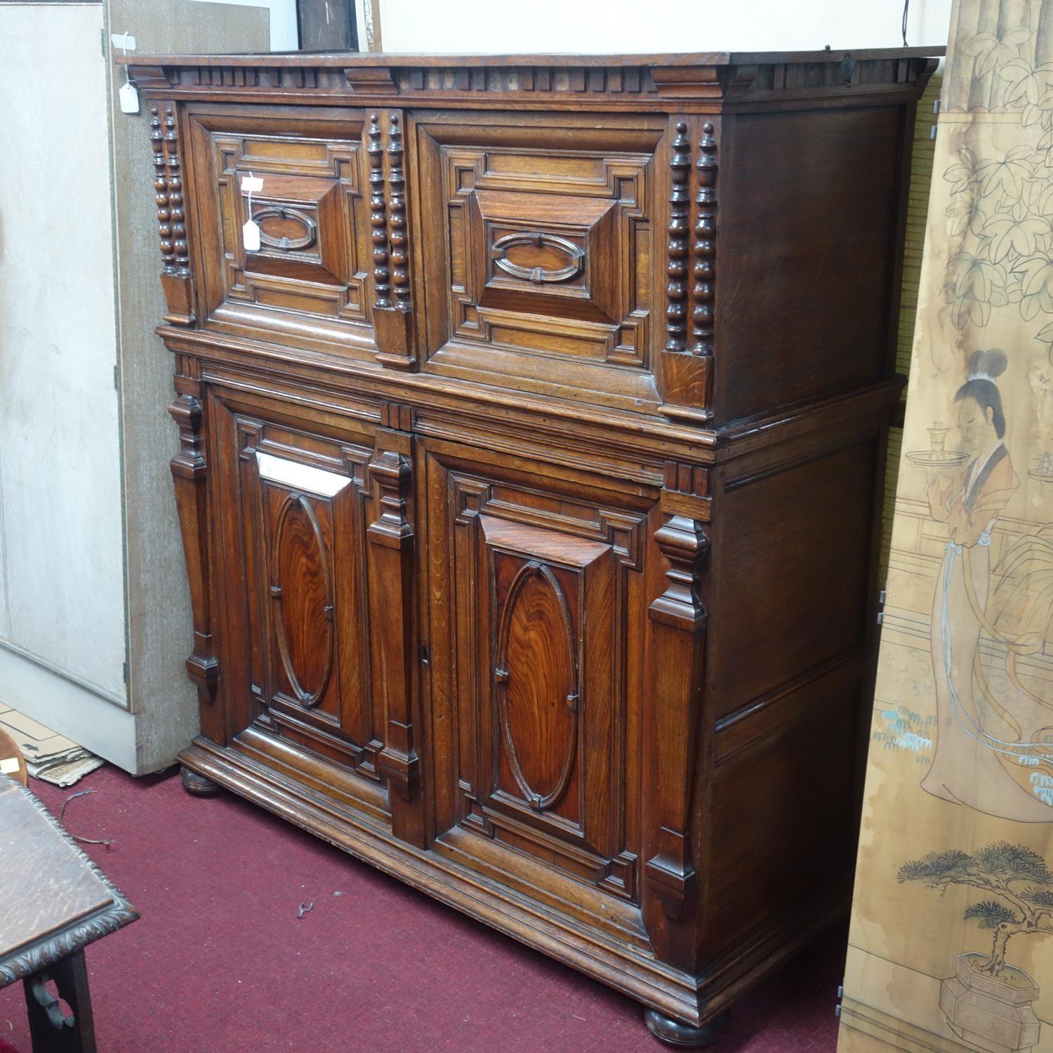A 17th century oak panelled Antwerp cabinet, with four carved panelled doors, on moulded base and - Image 2 of 3