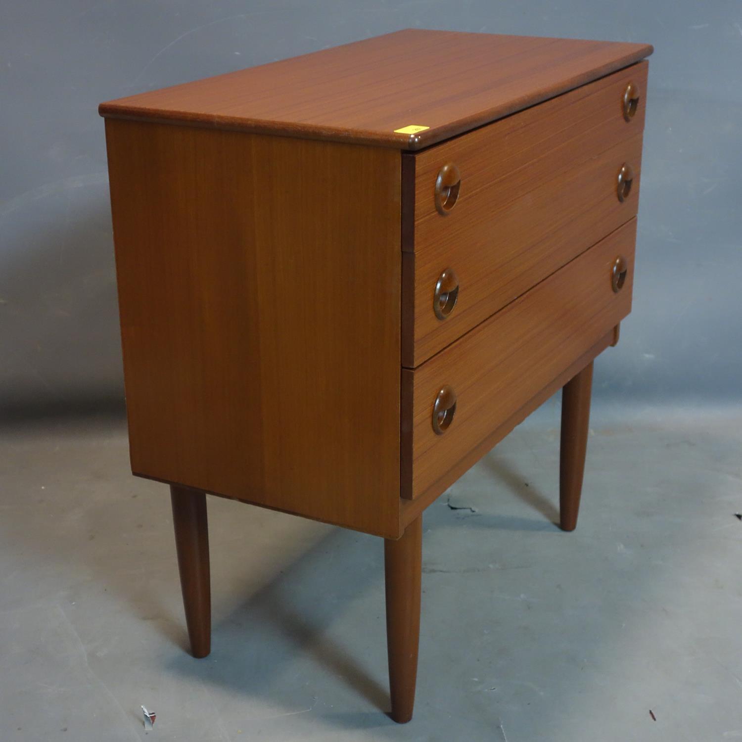 A teak chest of four long drawers, on tapering legs, H.74 W.75cm - Image 2 of 2