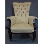 A Victorian mahogany grandfather armchair, with green silk upholstery decorated with Classical