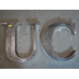 Two steel signage letters 'C' and 'U', H.51cm