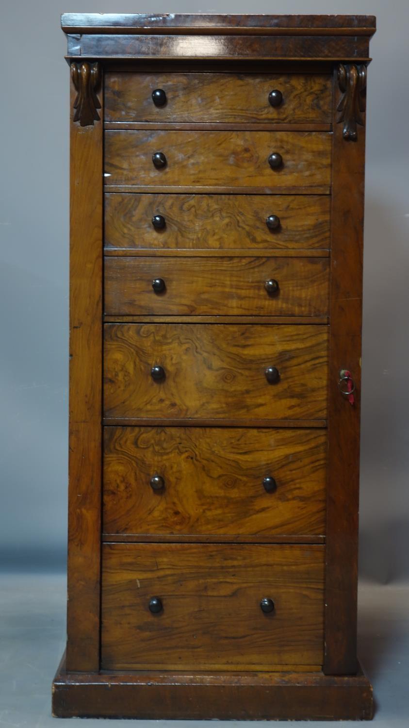 A 19th century mahogany and walnut wellington chest of 7 drawers, with key, H.127 W.56 D.40cm