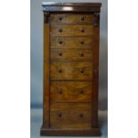 A 19th century mahogany and walnut wellington chest of 7 drawers, with key, H.127 W.56 D.40cm