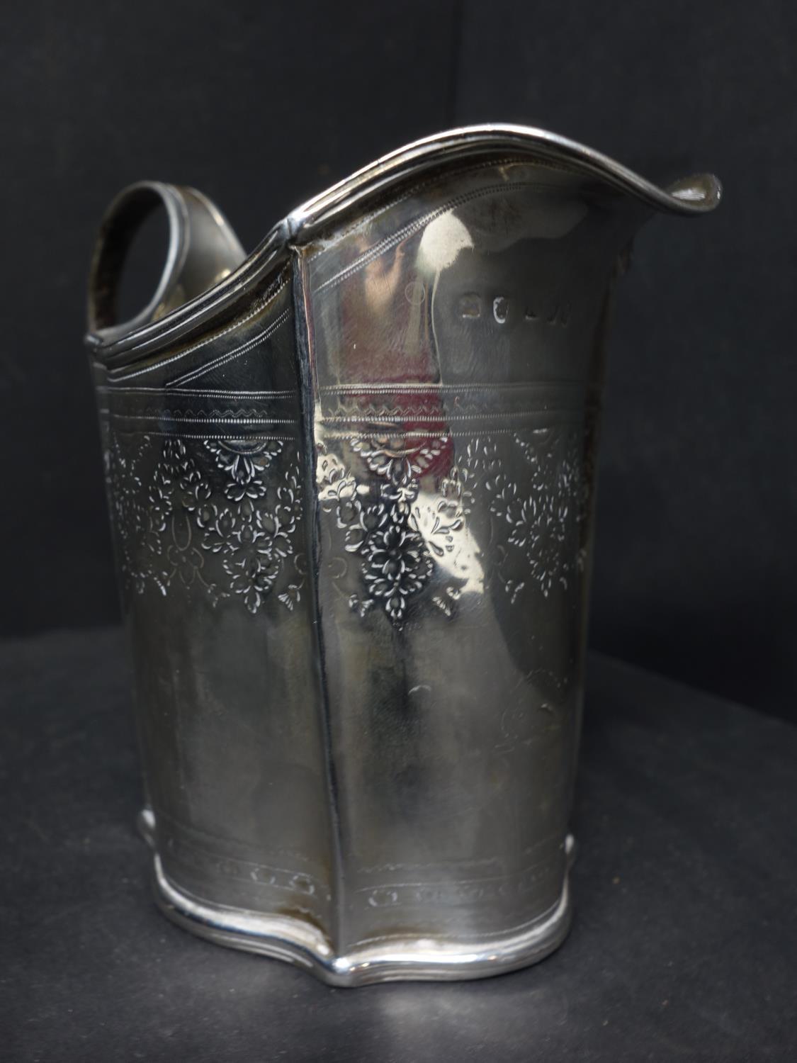 A Georgian silver milk jug, with engraved floral decoration, indistinctly hallmarked, H.10.5cm, - Image 4 of 6