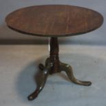 A 19th century oak tilt top table, H.71 D.87cm