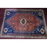 A Southwest Persian Shiraz carpet, central diamond medallion with repeating geometric motifs on a