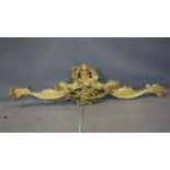 An antique carved gilt wood pediment, H.51 W.195cm