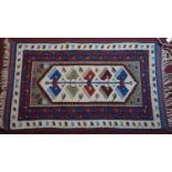 An Anatolian / Turkish prayer rug, repeating wing motifs on a cream ground within stylised floral