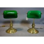 A pair of brass bankers lamps with green glass shades, H.35cm