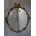 A 20th century French oval gilt mirror, with ribbon and floral decoration, H.57 W.50cm
