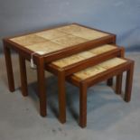 A 20th century teak nest of 3 tables with tile tops, H.42 W.67 D.47cm