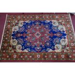 A Northwest Persian Tabriz carpet, central double pendant medallion with repeating petal motifs on a