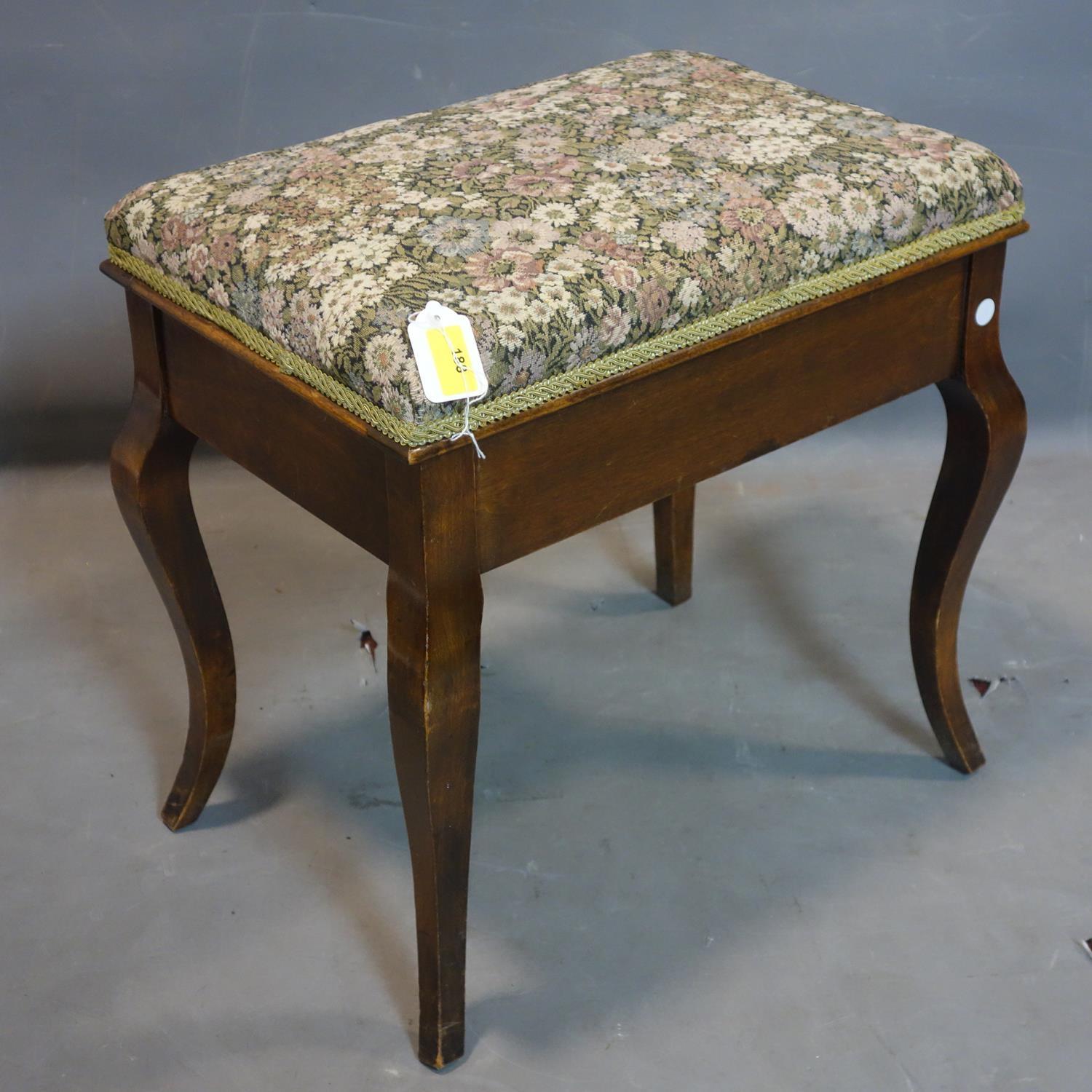 An Edwardian mahogany piano stool, with rising hinged lid, H.52 W.53 D.38cm