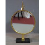 A contemporary circular gilt hanging mirror, with bevelled glass plate, on stand, H.77cm Diameter