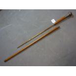 A vintage walking stick/fire poker with silver top and collar marked B.D.H, L.97cm