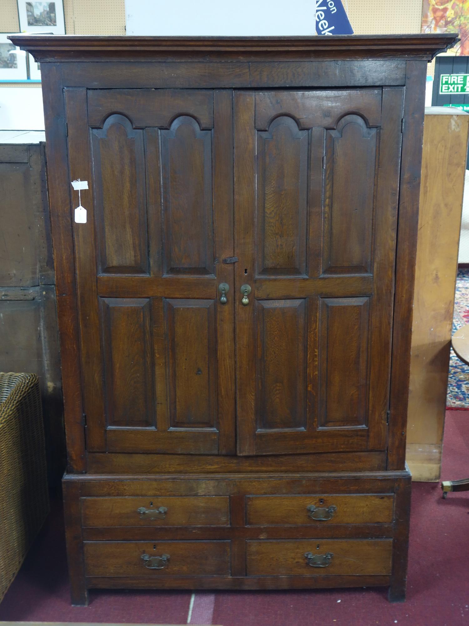 An early 18th century oak panelled linen press, c.1730, H.208 W.137 D.54cm