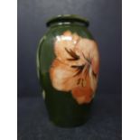 An early 20th century Moorcroft Hibiscus Miniature Vase, by William Moorcroft, with original label