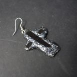 A single Andrew Logan crucifix earring, signed to verso, H.4.3cm