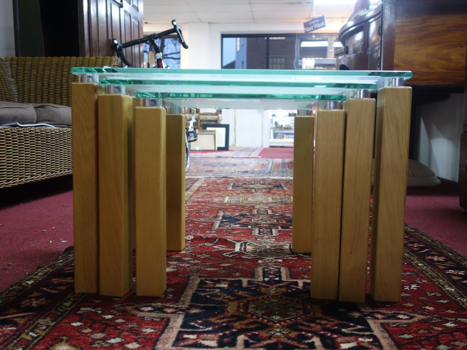 A nest of three modern glass and beech occasional tables, H.39 W.57 D.55cm (largest) - Image 2 of 2