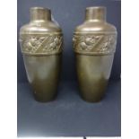 A pair of brass vases, each decorated with bands of flowers, makers mark to bases, H.35cm