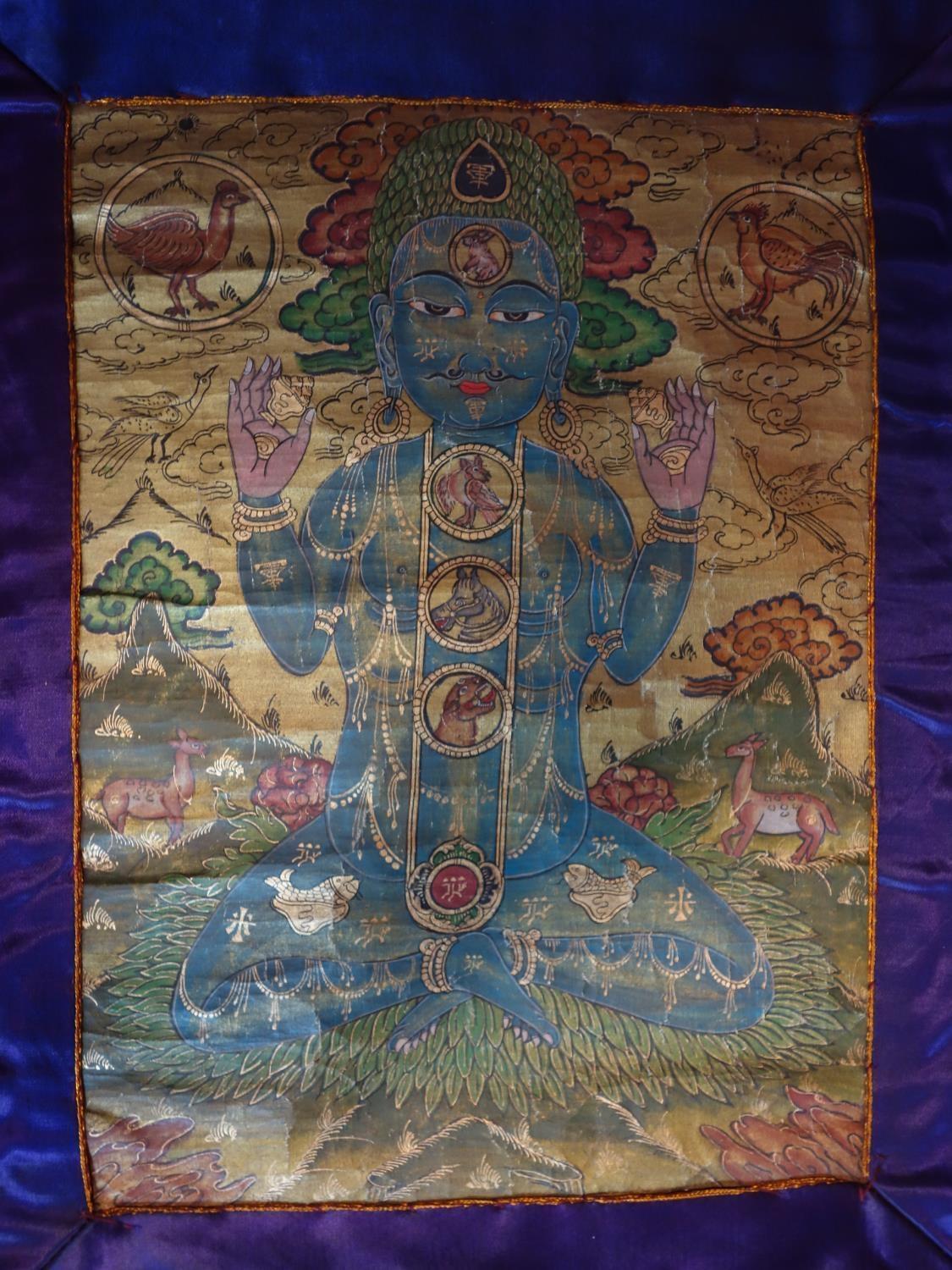 A hand-painted Tibetan Thangka depicting a deity in a landscape scene with animals, having script to - Image 3 of 7