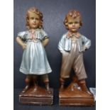 A pair of early 20th century figures of a boy and girl, each titled Truant to base, numbered 750 (