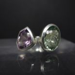 A silver, amethyst and green amethyst set ring, stamped 925, size Q