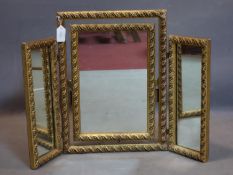 A 20th century gilt triptych dressing mirror, with central swing mirror, H.52 W.70cm