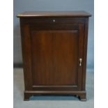 A Victorian mahogany cupboard, with brush slide above cupboard door, on bracket feet, H.84 W.65 D.