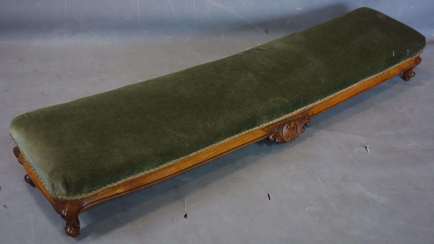 A Victorian carved walnut footstool with green velvet upholstery, on cabriole legs, H.19 W.123 D. - Image 2 of 2