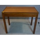 A teak foldover card table, stamped Staverton, raised on square legs, H.71 W.92 D.51cm
