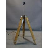 A contemporary teak and chrome adjustable tripod standard lamp, H.106cm fully extended