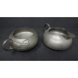 A Liberty & Co. Tudric pewter sugar bowl and creamer by Archibald Knox, model no.0231, H.6 W.12 D.14