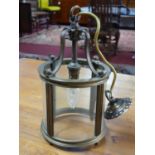 A 1930's brass and glass hanging ceiling lantern, with scrolling supports and four glass panels, H.