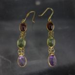 A pair of 14ct gold earrings set with 3 multi coloured stones