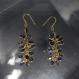 A pair of 14ct gold and sapphire cluster earrings