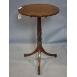 A 19th century mahogany tilt top lamp table, on turned support and outswept legs, H.70cm Diameter
