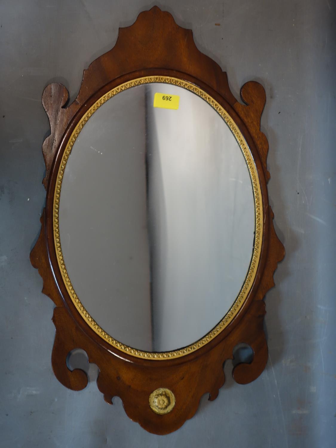 A 19th century mahogany fretwork mirror with oval glass plate, 66 x 40cm