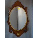 A 19th century mahogany fretwork mirror with oval glass plate, 66 x 40cm