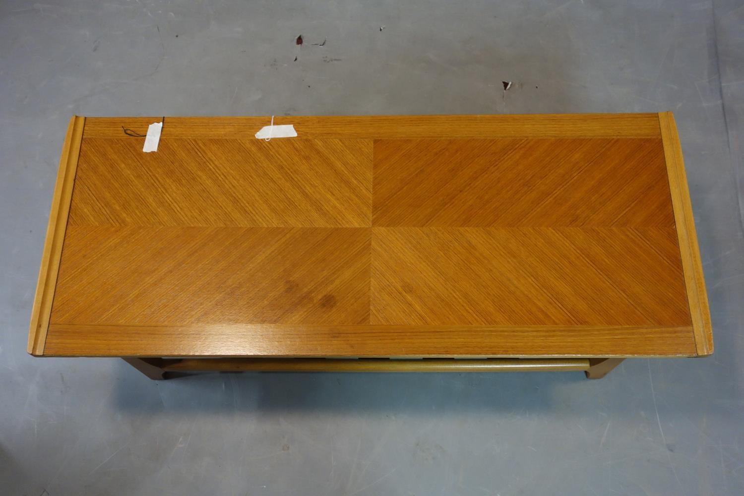 A teak coffee table, with undertier rack, H.35 W.111 D.46cm - Image 3 of 3