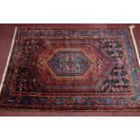 A Northwest Persian Zanjan rug, central diamond medallion with repeating petal motifs on a