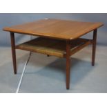 A 20th century Danish teak coffee table, with wicker undertier, raised on tapered legs, H.50 W.80