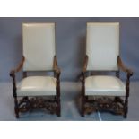 A pair of French mahogany armchairs, with shaped scroll arms on turned supports, H.120 W.62cm
